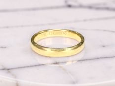 A 22ct yellow gold band ring, size L CONDITION REPORT: 4.