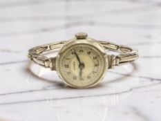 A lady's 9ct gold plated Tymo wristwatch on expansion bracelet,
