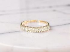 A yellow gold diamond half eternity ring, ring size O CONDITION REPORT: 1.