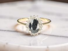 A 9ct yellow gold sapphire cluster ring, size O CONDITION REPORT: 1.