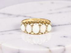 An 18ct yellow gold five stone opal ring,