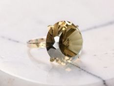 A yellow gold smoky quartz ring, shank stamped 14k,