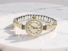 A lady's 9ct yellow gold Everite wristwatch on gold-plated strap,