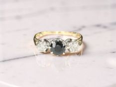 An 18ct yellow gold two stone diamond and sapphire ring, size N CONDITION REPORT: 2,