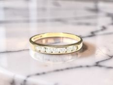 A 9ct yellow gold half eternity ring, approximately 0.