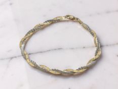 A 9ct two-tone gold bracelet, length 18.5 cm CONDITION REPORT: 2.