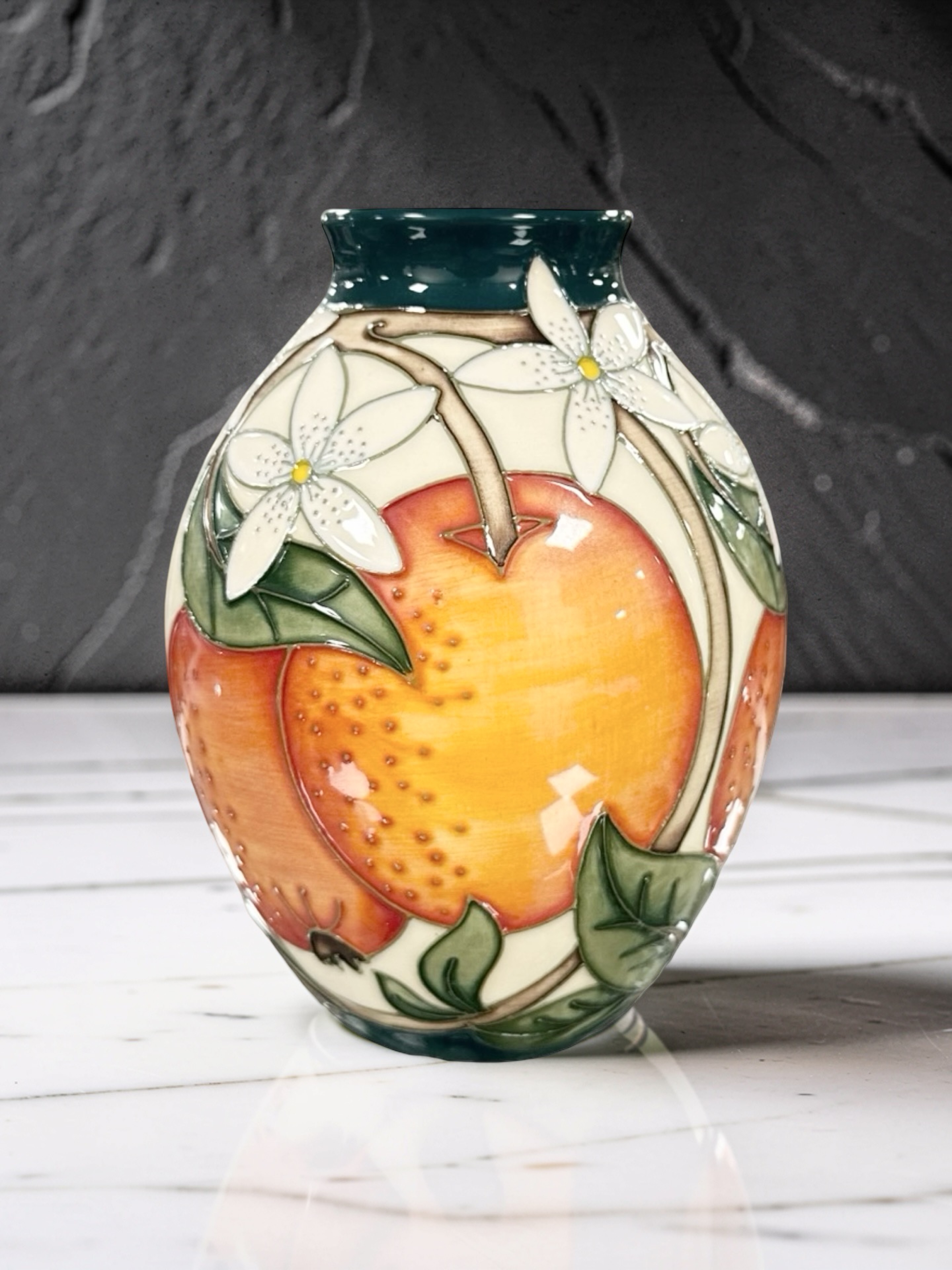 A modern Moorcroft 'Oranges and Blossom' ovoid vase, designed by Rachel ...