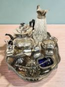 An EPNS pierced gallery serving tray together with a three-piece tea service, decanter, sifters,