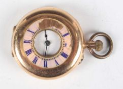 A 14K gold and enamelled half-hunting cased keyless wind lady's fob watch with unsigned movement,