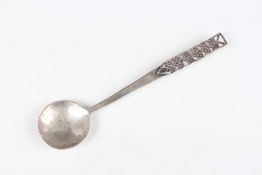 A George V Arts and Crafts silver serving spoon with hammered circular bowl, the pierced Celtic knot