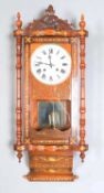 A late 19th century American inlaid walnut wall clock with eight day movement striking on a gong,