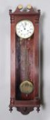 A 20th century mahogany cased Vienna wall clock with eight day movement striking on a gong, the