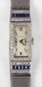 An Art Deco Cartier platinum, diamond and sapphire lady's bracelet dress watch, the jewelled oval