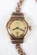 An IWC (International Watch Co) 14K gold cased lady's wristwatch with signed and jewelled