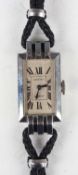 An Art Deco Cartier London stainless steel rectangular cased lady's wristwatch, circa 1934, the