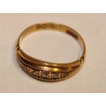 An 18ct gold gypsy-style dress ring set five graduated diamonds (2.