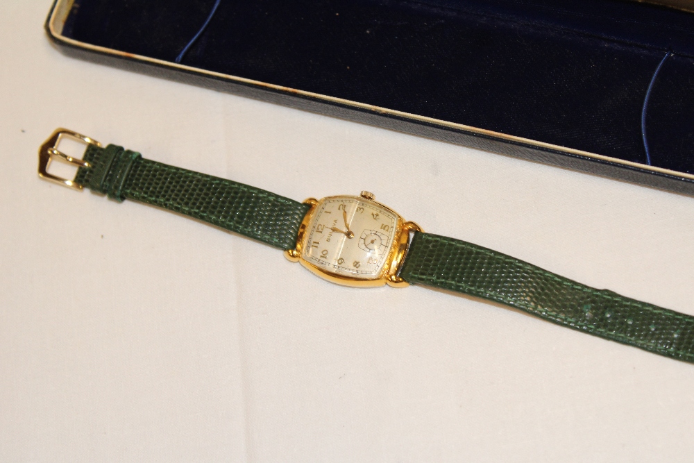 A gentleman's gold mounted wrist watch by Bulova with later leather strap