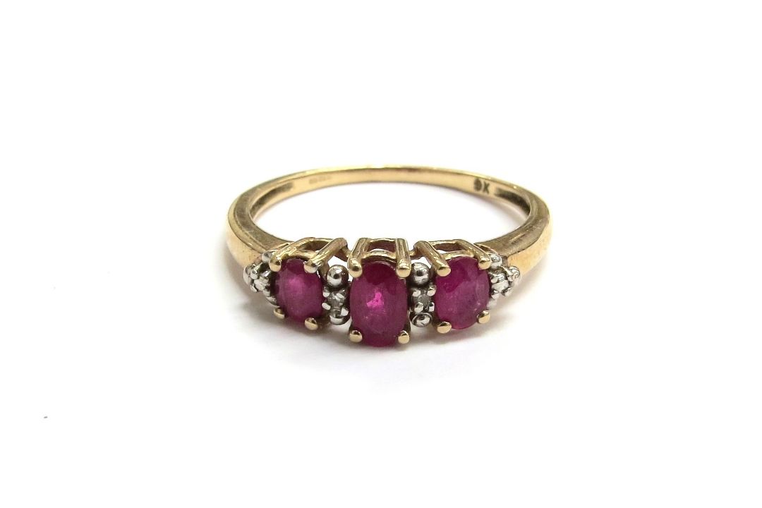 A 9ct gold ruby and diamond ring. Size O/P, 1.8g - Image 1 of 2