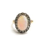 An opal and diamond cluster ring, gold shank unmarked has been re-sized. Size P, 3.8g