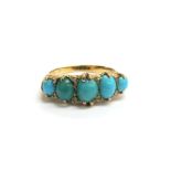 A gold ring set with five graduating turquoise spaced by old cut diamonds, marks rubbed. Size P, 4.