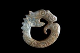 Jade pendant in the shape of a coiled dragon