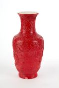 Porcelain vase with red lacquer