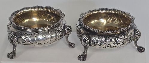 A pair of Victorian silver Salts, HM London 1868, floral repousse decoration and lions feet, GC