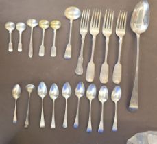 A Georgian silver serving spoon HM London 1792; a set of four Georgian silver teaspoons HM London