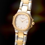 A LADY'S FINE STEEL, SOLID GOLD & DIAMOND PATEK PHILIPPE NAUTILUS BRACELET WATCH CIRCA 1990s, REF.