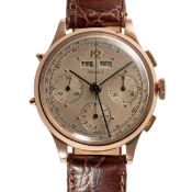 A GENTLEMAN'S SIZE 14K SOLID ROSE GOLD DOXA TRIPLE CALENDAR CHRONOGRAPH WRIST WATCH  CIRCA 1950