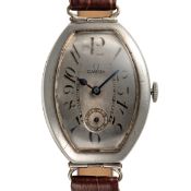 A GENTLEMAN'S LARGE SIZE SOLID SILVER OMEGA PETROGRAD TONNEAU WRIST WATCH CIRCA 1915, MADE FOR THE