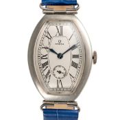 A GENTLEMAN'S LARGE SIZE SOLID SILVER OMEGA PETROGRAD TONNEAU WRIST WATCH CIRCA 1930s, MADE FOR