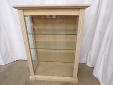 Limed effect display cabinet having three adjustable glass shelves, standing on plinth base - 43cm x