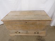Pine chest having lift top lid, two short drawers to base and metal carrying handles, standing on