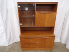 Mid century wall unit, the top section having a glazed door opening to two adjustable glass