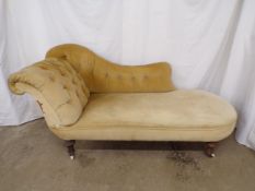 Chaise longue upholstered in light gold/cream upholstery having buttoned back and side support,
