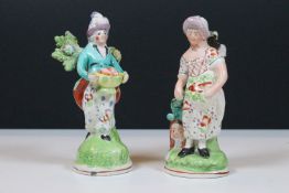 Pair of 19th century Staffordshire figurines of two women holding baskets, tallest measures 16cm (
