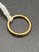 A gold split ring 15ct gold 13mm diameter