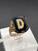 A antique 19th century rolled gold signet ring with black onyx stone size T