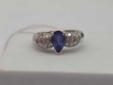 A WHITE GOLD TANZANITE AND DIAMOND RING 14CT GOLD SIZE O 5 GMS