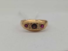 A antique ruby and diamond ring 18ct gold size P 1.9 gms