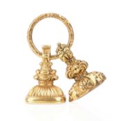 A 19TH CENTURY GOLD SPLIT RING SUSPENDING TWO SEALS, including a gold cased seal set with a
