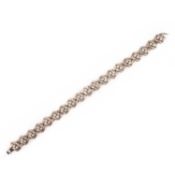 A DIAMOND-SET WHITE GOLD BRACELET, composed of textured white gold links of crossover design, each