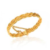 A CHINESE GOLD BANGLE, of plaited design, to a screw-action clasp with gold safety chain, Chinese