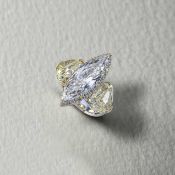 AN IMPRESSIVE DIAMOND THREE STONE RING, set with a marquise-shaped diamond to the centre weighing