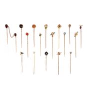 A COLLECTION OF 17 STICK PINS, comprising seventeen stick pins capped with; a rose-cut diamond in