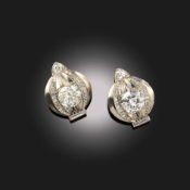 SUZANNE BELPERRON, A PAIR OF DIAMOND EARRINGS, C1935, each set with a cushion-shaped diamond