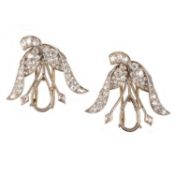 A PAIR OF DIAMOND CLIP MOUNTS, each composed of a foliate surmount pavé-set with graduated old