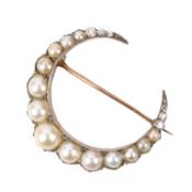 A CULTURED PEARL AND DIAMOND BROOCH, of closed crescent moon design set with graduated cultured