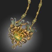 AN ART NOUVEAU DIAMOND, GOLD AND ENAMEL PENDANT, C1905, centred with a lily pond with bullrushes and